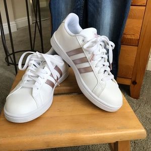 White and rose gold Adidas sneakers